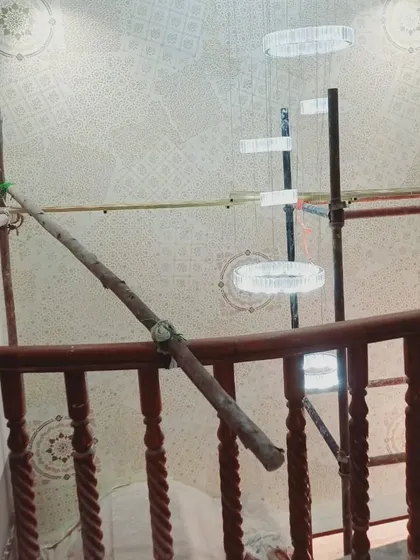 This is a view of a large-scale decorative project in progress. We use scaffolding to safely and precisely apply intricate stencil patterns to high ceilings and walls, ensuring a perfect result even in challenging spaces.
