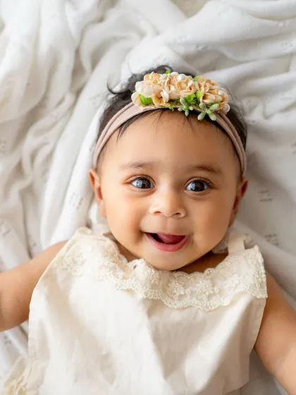Oh, that smile! This is from a 6-month milestone session, and it's pure magic. I focus on capturing these simple, authentic expressions up close because they are the ones you'll want to remember forever.
