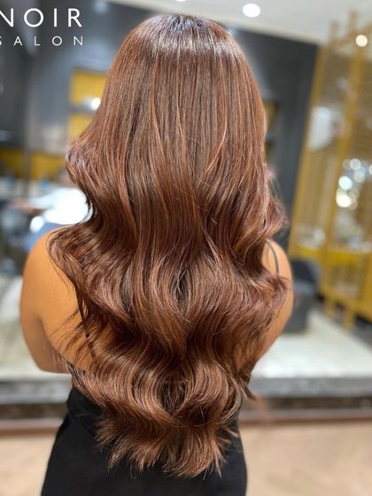 A Friday feature showcasing a beautiful, warm brunette color. The long, healthy waves are full of shine and dimension.