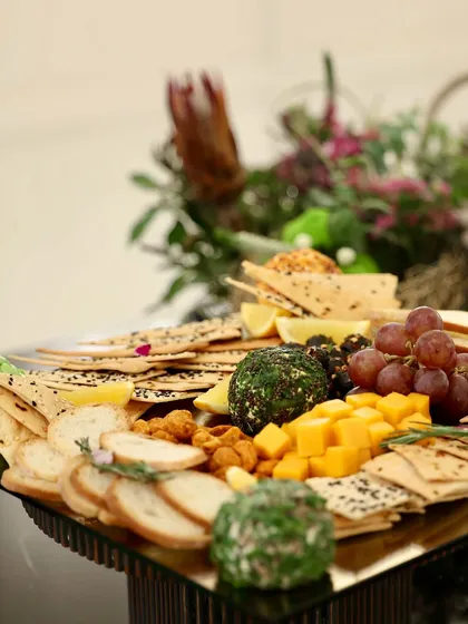 A cheese and cracker board from the grand launch of The Rose Watch Bar, designed to match the elegance of the occasion.