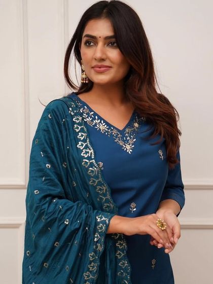 A stylish blue viscose chanderi kurta pant set. The heavy thread embroidery and sequin work on the dupatta add just the right amount of sparkle.