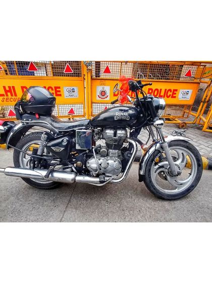 This is the ride of a lion. My Royal Enfield parked in front of Delhi Police barricades, a symbol of my willingness to go anywhere the fight takes me.
