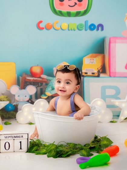 A Cocomelon-themed bath time shoot. Incorporating popular characters makes the session extra fun and relatable for the little ones.