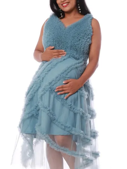 This convertible pastel blue gown can be worn as a short, high-low frock or a full-length gown, offering two distinct looks for your maternity photos.