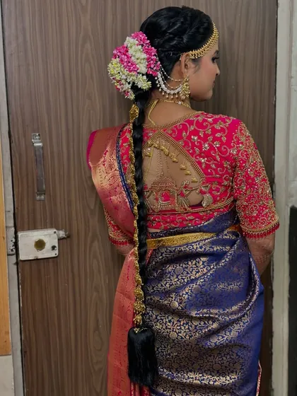 Another angle of the intricate bridal braid, showing how the accessories are woven into the hair. I work with expert hairstylists to create these stunning traditional looks.