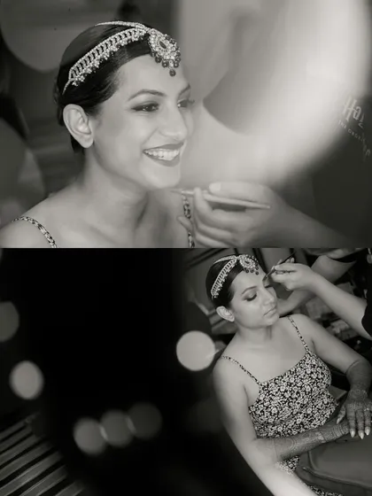 The bride's smile shines through as her makeup is applied. We use creative framing and bokeh to add an artistic touch to these getting-ready photos.