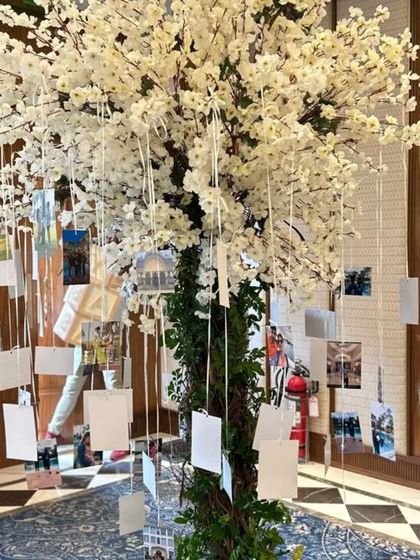 A wishing tree is a beautiful and interactive element for a baby shower. Guests can hang their wishes and photos for the baby, creating a heartfelt and personal centerpiece for the event.