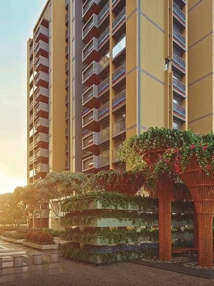 These unique, tree-like structures are actually large-scale planters, adding verticality and a burst of green to the landscape of this modern building.