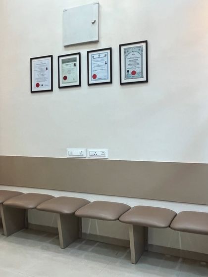 Your comfort is important. This is our patient waiting area, where you can see my framed qualifications, assuring you that you are in expert hands.