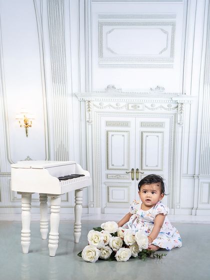 From lattes to fairytales, every setup is brewed with love. This collage shows a baby girl enjoying both a Starbucks barista theme and an elegant piano session.