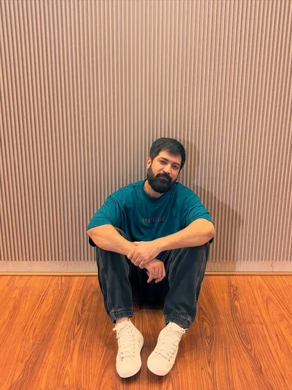 Sitting on the studio floor between shots. These quiet moments are filled with thoughts and inspiration.