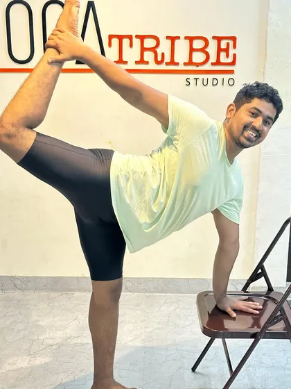 The smile shows the joy of finding the pose. Using the chair for support in Natarajasana allows for a deeper, more enjoyable experience of the backbend.