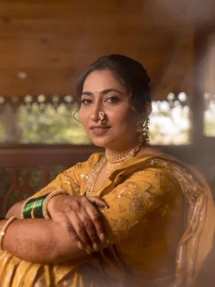 A gentle smile from the bride, looking comfortable and radiant.