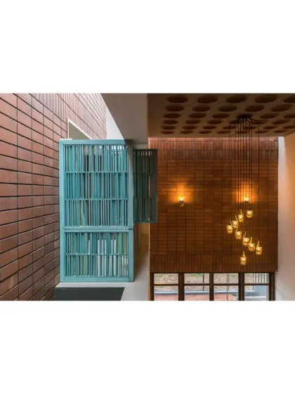 A detail from 'An Earthy Affair', which was part of our award-winning entry. The turquoise-painted library nook provides a pop of color against the warm brick.