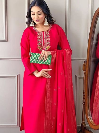 This rani pink kurta set is a classic festive look. The jacquard woven dupatta and thread embroidery on the kurta make it rich and celebratory.