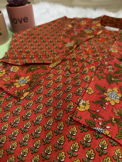 A closer look at the details of our print-on-print magic. This bandi set combines bold florals with classic stripes for a truly unique and stylish outfit.