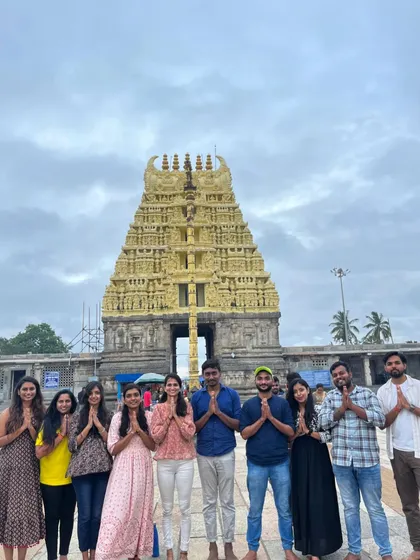 A group offering prayers at the entrance of a historic temple. My trips respect local customs and provide an authentic cultural experience.