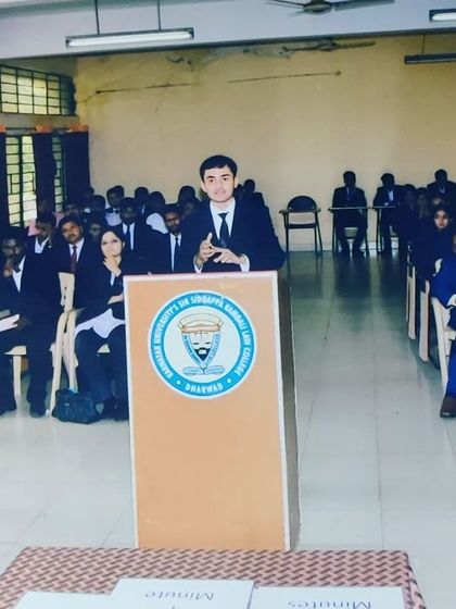 Another view of a student presenting their case during a moot court competition. These events are crucial for developing the courtroom presence and confidence needed for a career in litigation.