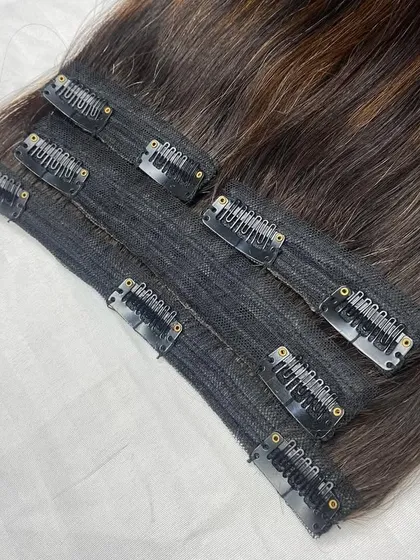 This is a full 4-piece, 150gm set of clip-in extensions. You can see the different weft sizes and the placement of the secure clips, designed for a full head application.