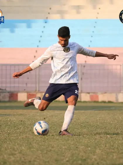 A player strikes the ball, captured at the moment of impact.