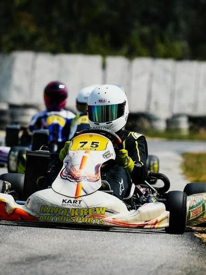 Our driver in the number 75 kart, showing excellent control on the edge of the track.
