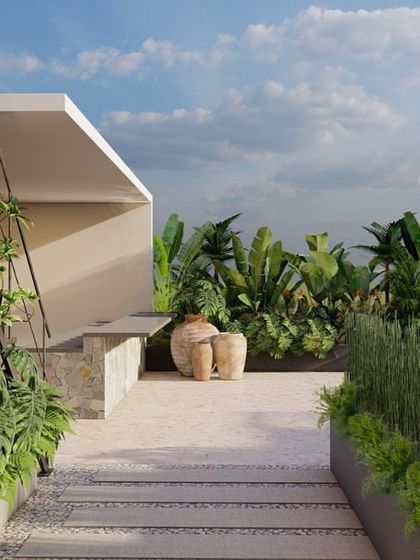 A view of a multi-level terrace garden we designed. The space includes a mix of stone pathways, raised planters with tropical foliage, and a spiral staircase, creating a dynamic and interesting landscape.