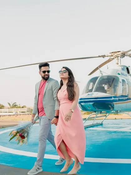 Making a grand entrance into their new life together. This stylish shot from a helicopter pre-wedding shoot in Pune is the definition of luxury and modern romance, creating an unforgettable memory.