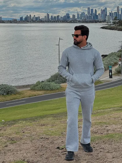 Redefining casual comfort with our signature grey flared unisex tracksuit. This set combines a relaxed hoodie with fashion-forward flared bottoms, proving that comfort and high style can coexist beautifully.