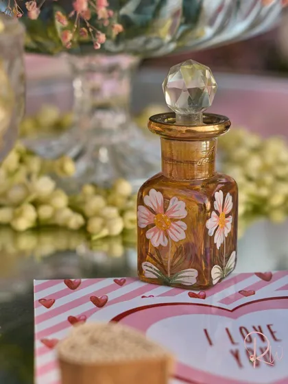 The beautiful, hand-painted ittar bottle, a perfect example of a personalized element that doubles as decor.
