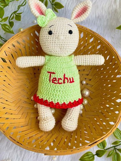 Another one of my popular bunny designs, this time in a lovely green dress with red trim, personalized with the name "Techu". I never get tired of making these sweet friends.