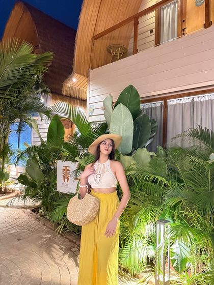 A full-length shot of the outfit, showing how the pieces come together for a perfect vacation look.