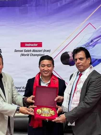 Exchanging mementos with the President of the Nepal Karate Federation. Our joint training camp was a landmark event for South Asian karate development.