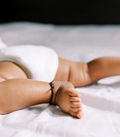 A close-up on the baby's chunky legs and tiny feet during his six-month session. I love capturing these adorable details.