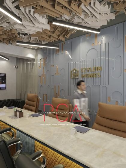 A wide view of the StyleIn Homes conference room, capturing the full effect of the ceiling, wall treatments, and custom furniture.