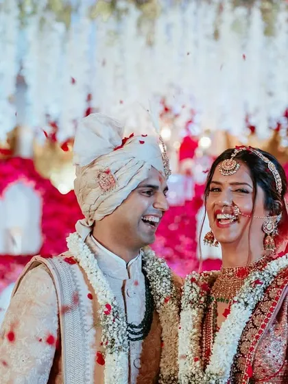 Laughter under a shower of petals. These are the priceless moments that become cherished memories for a lifetime.