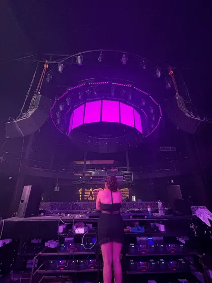 A view from behind me, showing the impressive circular lighting rig of the club.