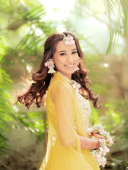 A lovely portrait of the bride, with her hair catching the breeze. Our floral jewellery is designed to look beautiful from every angle.