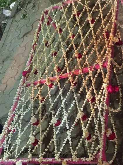 This is a traditional 'Dulhaniya Chaadar' I crafted for a bridal entry. It is hand-woven with fragrant rajnigandha (tuberose) and red roses, creating a beautiful floral canopy for the bride's grand entrance.