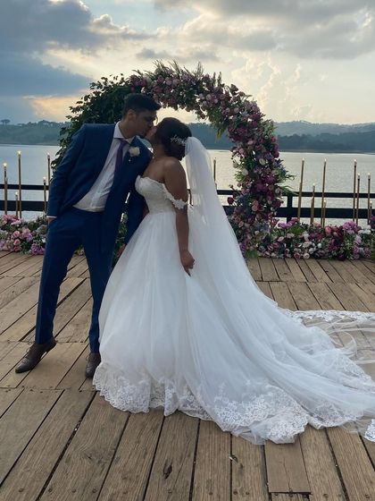 A breathtaking shot of the bride and groom. Her elegant updo is perfect for supporting a long, dramatic veil.
