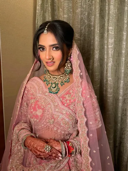 A close-up of the modern pink bridal look, showing the defined eye and the flawless, radiant skin.