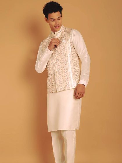 An embroidered bundi jacket that adds vibrancy to a traditional white kurta pajama. The timeless allure of embroidery adds elegance and sophistication.