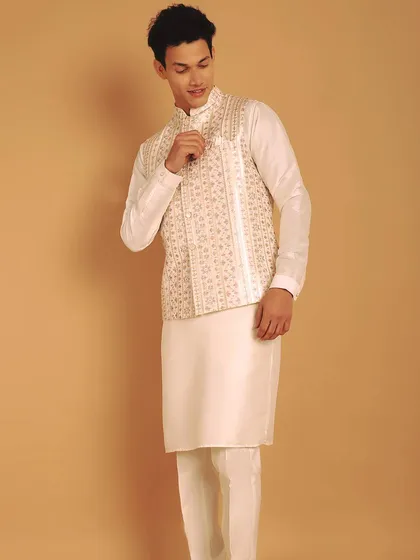 An embroidered bundi or jacket adds vibrancy to a traditional Kurta Pajama outfit. This off-white set is apt for any occasion, with my master tailors ensuring it fits you like a dream.
