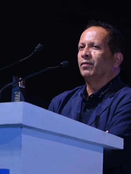 A speaker at the podium during a keynote address, setting the tone for a day of learning and discovery.