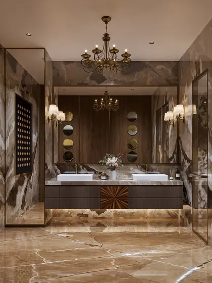 A bathroom concept that exudes classic luxury, with warm-toned marble floors and walls, a double vanity, and ornate wall sconces. The design feels both opulent and timeless.