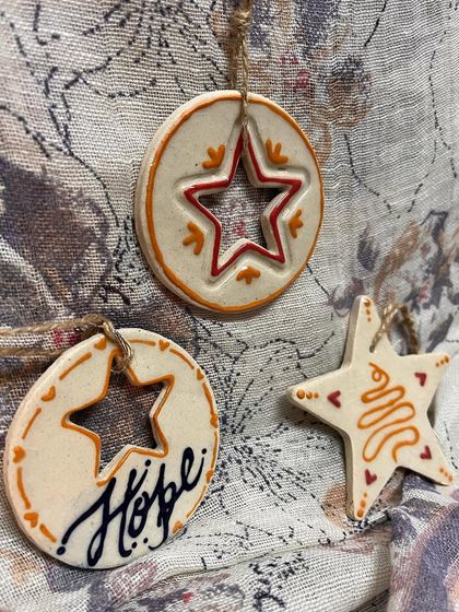 The full set of three ornaments, showing the different shapes and designs that work together.