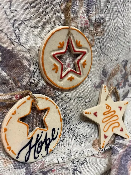 The full set of three ornaments, showing the different shapes and designs that work together.