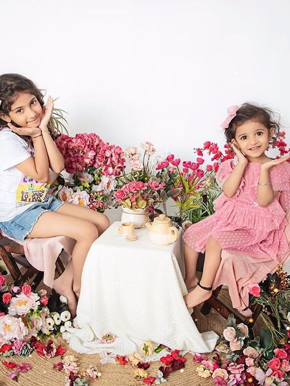 A sweet sisters' tea party. This floral-themed sibling shoot is a whimsical and fun way to capture the bond between sisters.