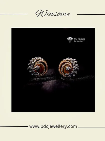 A winsome pair of swirling diamond stud earrings in 18kt gold. The modern and dynamic design is perfect for someone with a contemporary sense of style.