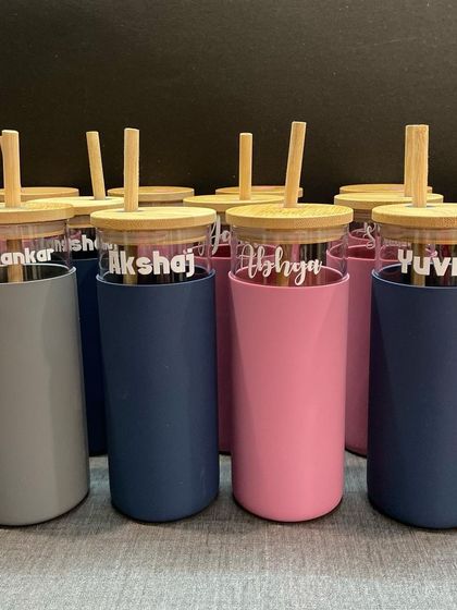 Another shot of our popular glass tumblers with bamboo lids. The combination of glass, wood, and the colorful sleeve is simply beautiful.