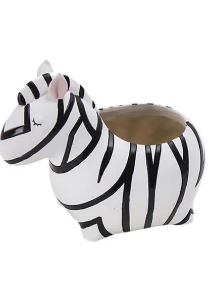 A clean product shot of the zebra resin pot. Its black and white stripes and cute, sleepy expression make it a standout piece for a modern or eclectic decor style.